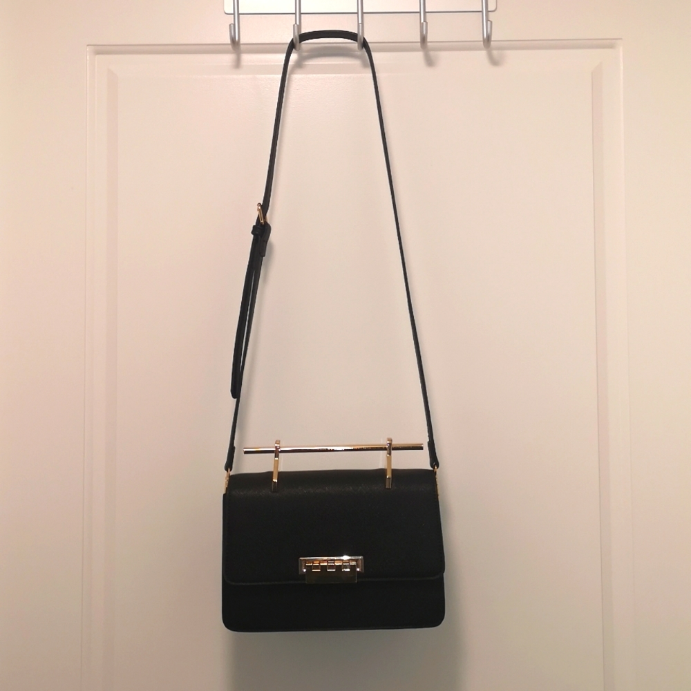 Structured crossbody top handle bag